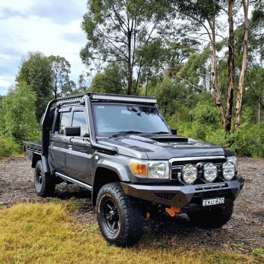 Toyota LandCruiser 79 Series with black Torqit snorkel, front quarter view
