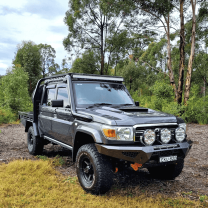 Toyota LandCruiser 79 Series with black Torqit snorkel, front quarter view