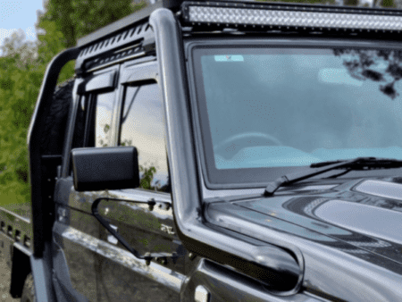 Torqit black 79 Series snorkel beside the windscreen