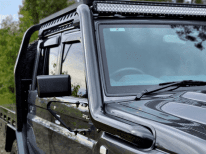 Torqit black 79 Series snorkel beside the windscreen